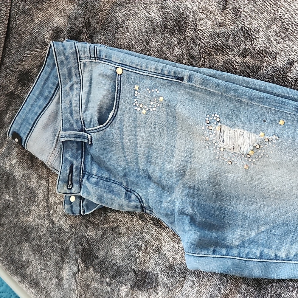 bebe faded blue jeans with rhinestones